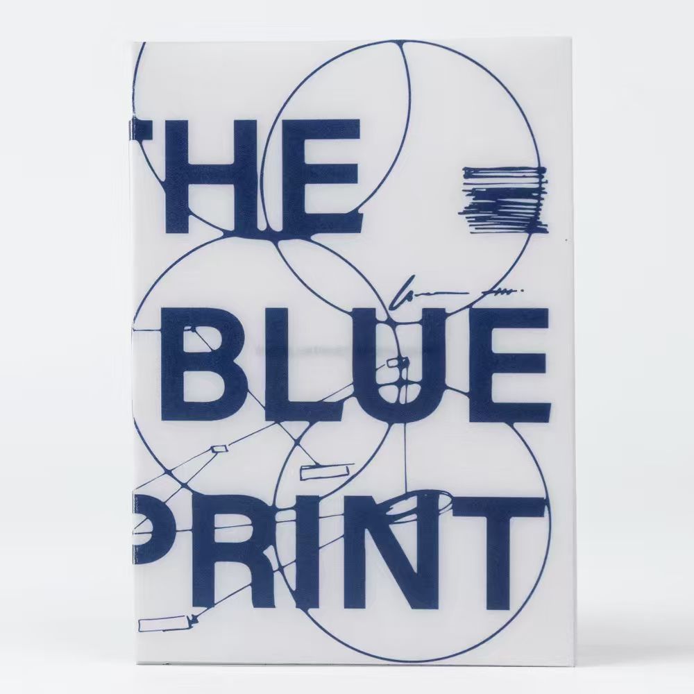 Book titled 'THE BLUE PRINT' with geometric design on a white background